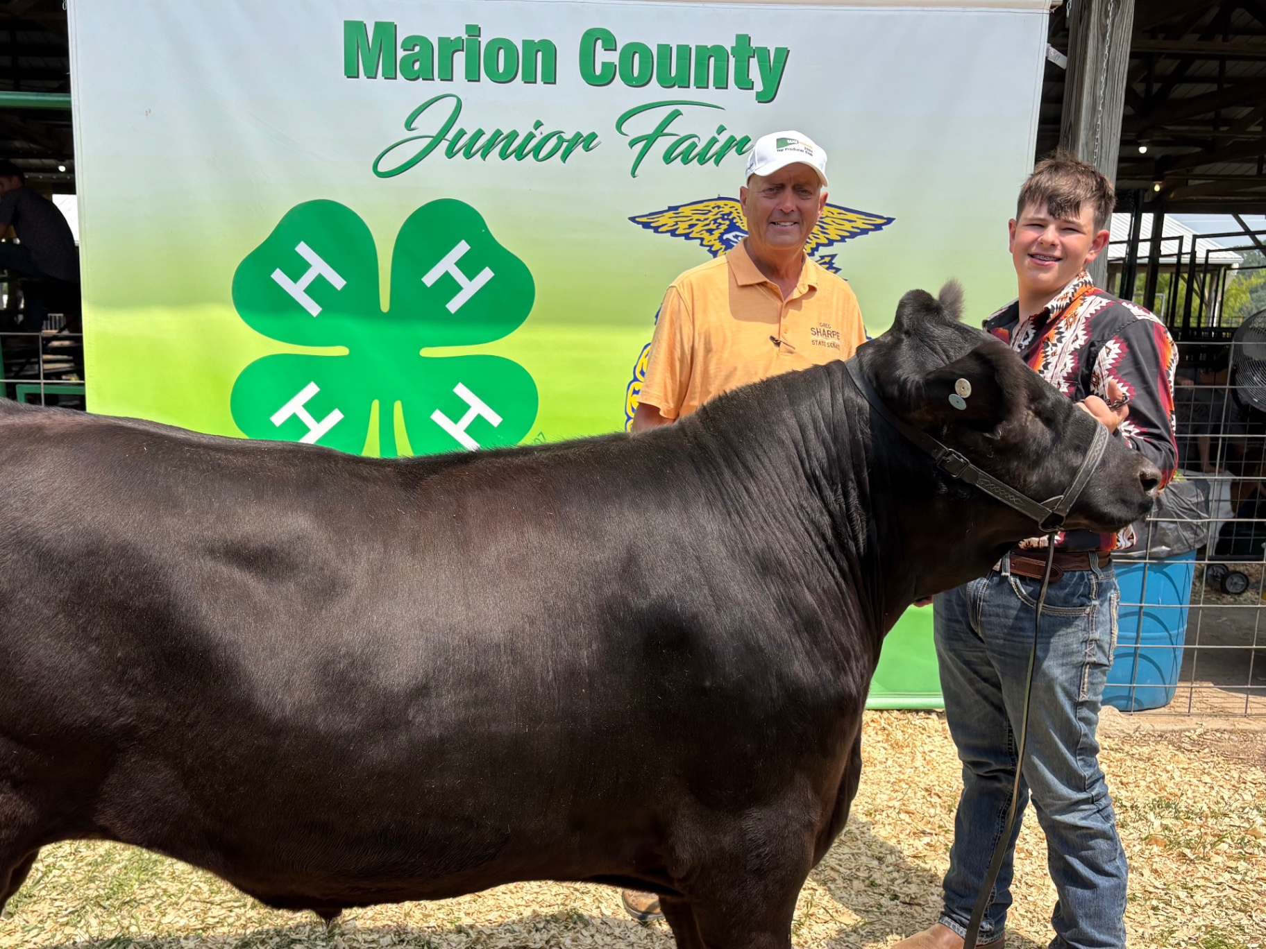 Greg Sharpe with a young livestock exhibitor and his steer at the Marion County Junior Fair