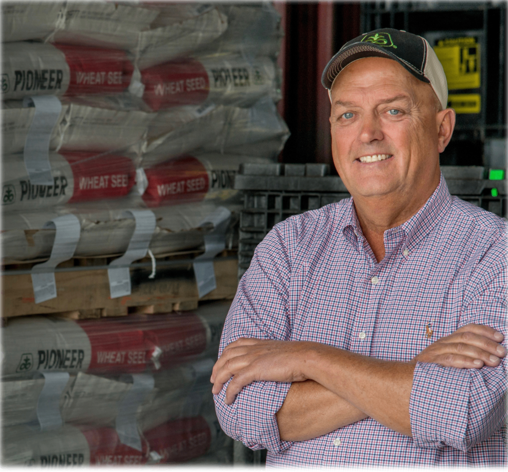 Greg Sharpe, Republican candidate for Missouri State Senate, standing in front of stacked Pioneer wheat seed bags